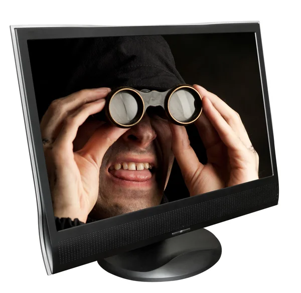 Człowiek z lornetka w monitor komputera — Zdjęcie stockowe