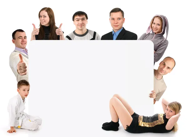 Skupina mladých drží prázdné desky — Stock fotografie
