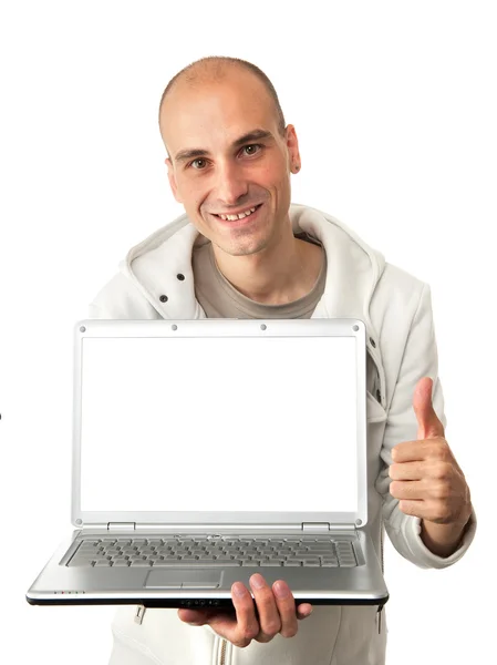 Человек с ноутбуком показывает большой палец вверх знак — стоковое фото