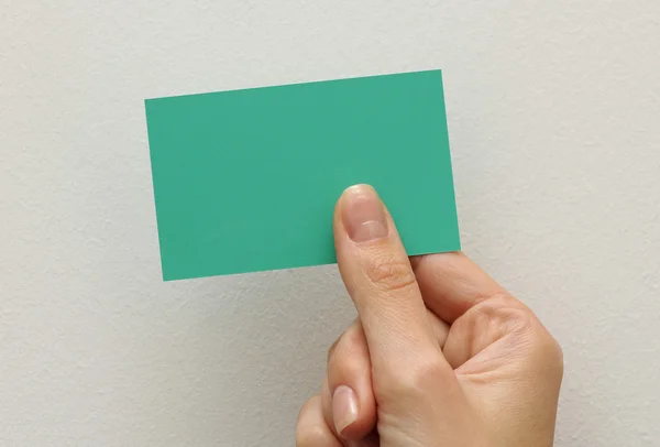 Hand with a business card — Stock Photo, Image