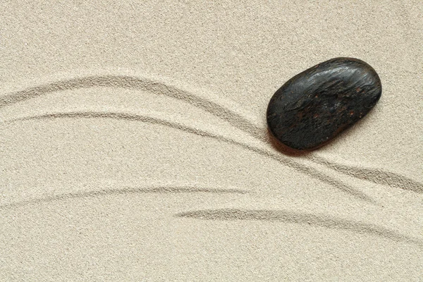 Stein auf Sand — Stockfoto