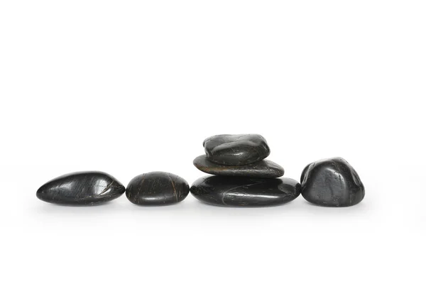 Piedras negras en blanco — Foto de Stock