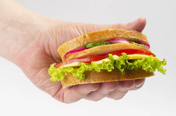 Dostal šunkový sendvič — Stock fotografie
