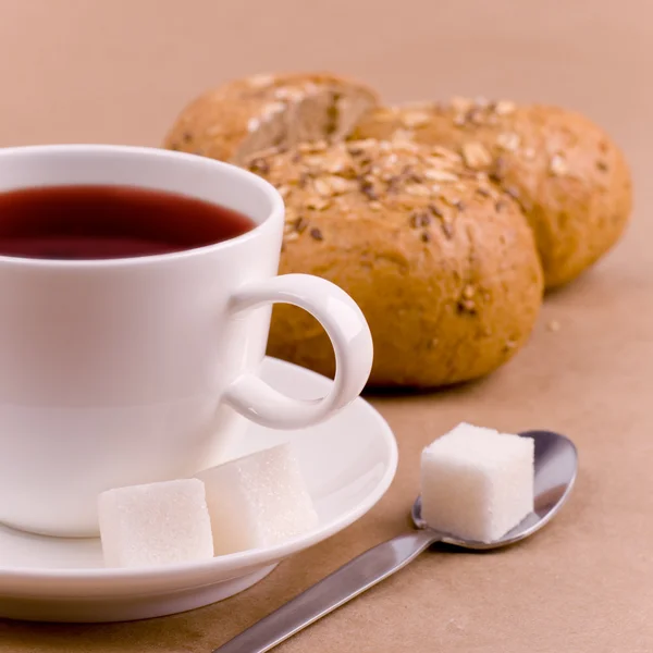 Cup of tea, sugar and bread — Stock Photo, Image