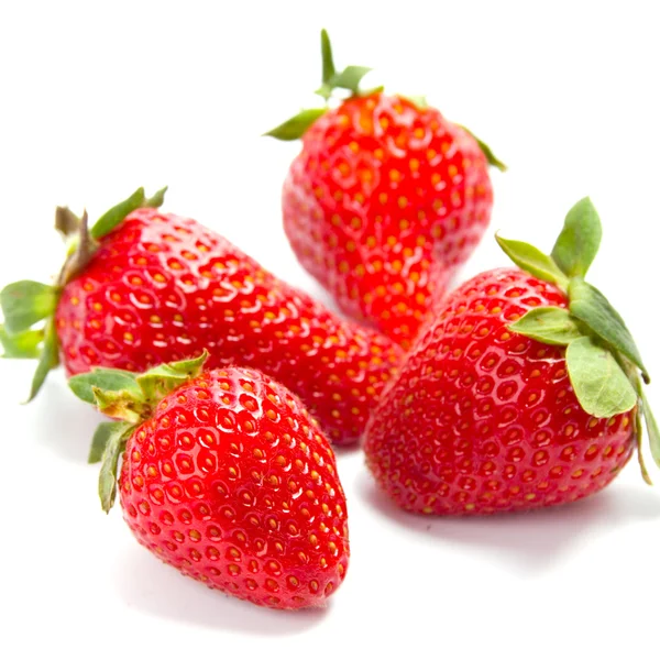 Four fresh strawberries — Stock Photo, Image