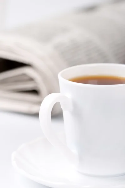 Cup of coffee and newspapers — Stock Photo, Image