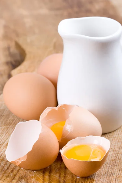 Brown eggs and some milk — Stock Photo, Image