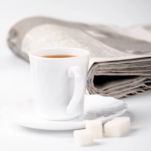 Cup of coffee, sugar and newspapers — Stock Photo, Image