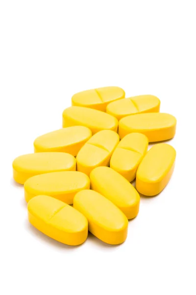 Píldoras de vitaminas amarillas —  Fotos de Stock