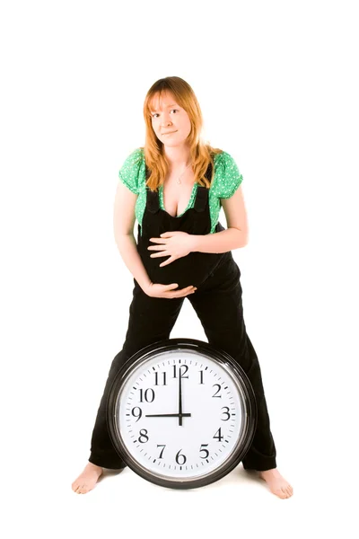 Gravid kvinna med en klocka — Stockfoto