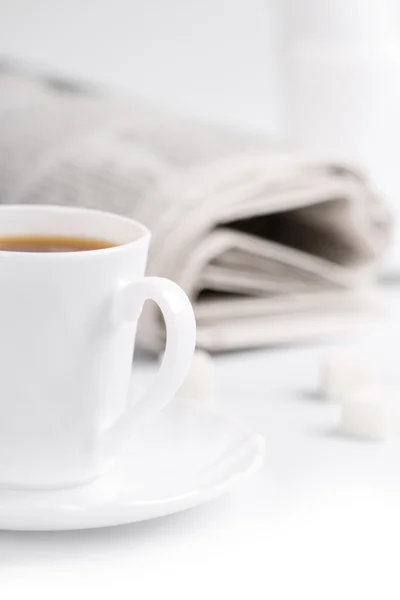 Coffee, sugar and stack of newspapers — Stock Photo, Image