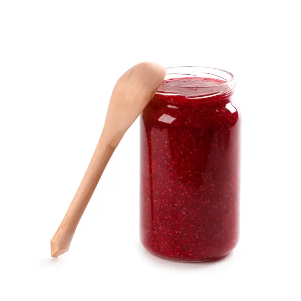 Homemade raspberry jam and wooden spoon — Stock Photo, Image