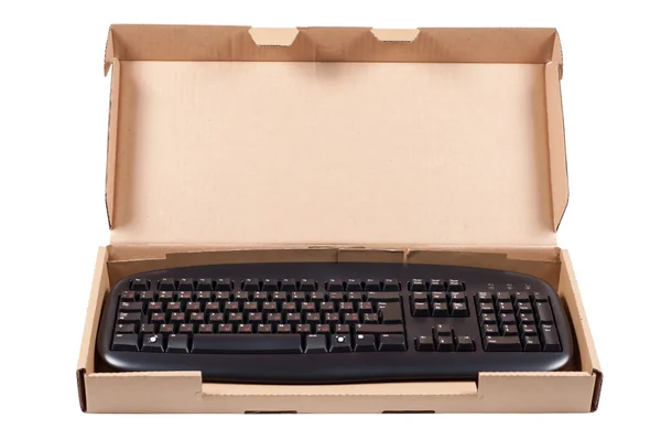 Die Tastatur in einer Box isoliert. — Stockfoto