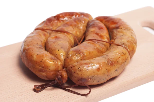 The appetizing braided sausage. — Stock Photo, Image
