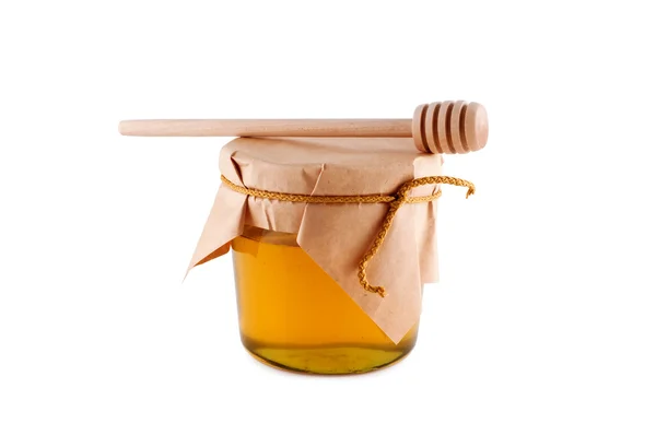 Honey in jar wooden spoon isolated white. — Stock Photo, Image