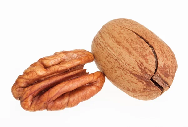 Few pecan nuts isolated on white, one cracked — Stock Photo, Image