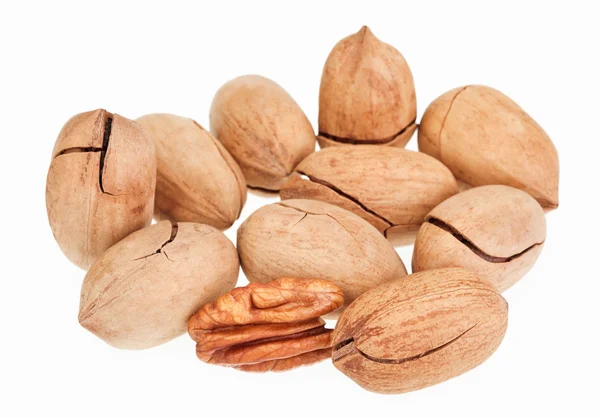 Many pecan nuts isolated on white, one cracked — Stock Photo, Image