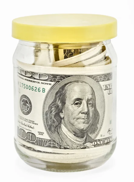 Many 100 US dollars bank notes in a glass jar — Stock Photo, Image