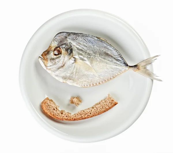 Salted moonfish with crust of bread on white plate — Stock Photo, Image