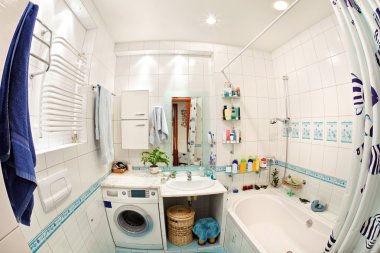 Modern small bathroom in blue colors wide angle view clipart