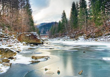 Winter landscape with blue water mountain river clipart