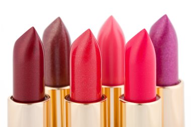 Multicolored color lipsticks arranged in two lines clipart