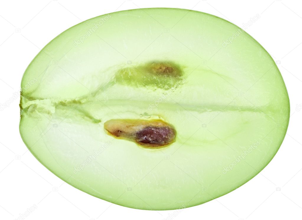 Translucent slice of green grape fruit, macro isolated on white