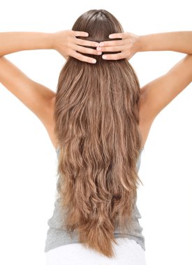 Brunette lady holding long hairs, view from back side isolated o clipart