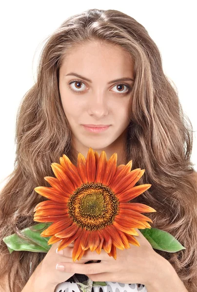 Young beautiful woman with long hairs holding sunflower near fac — Stock Photo, Image