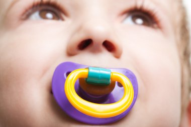 Child with baby pacifier clipart