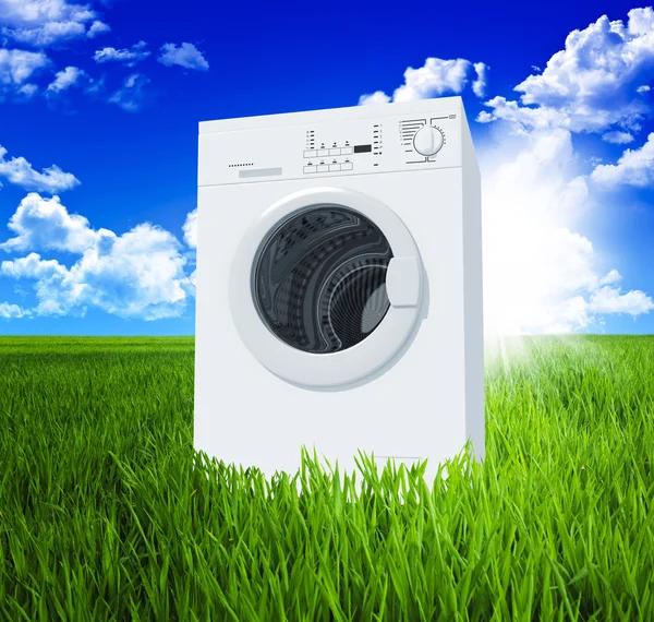 Washing machine and green field — Stock Photo, Image