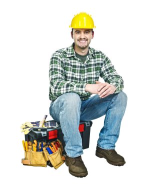 Young manual worker and toolbox clipart