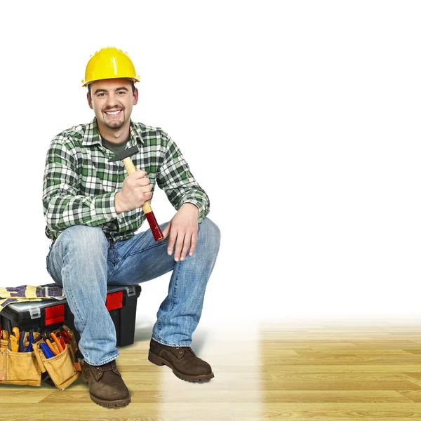 Handyman on wood floor — Stock Photo, Image