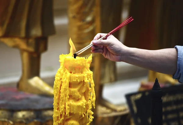 Flame on yellow candle — Stock Photo, Image