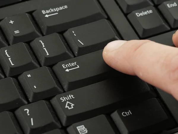 Finger pressing keyboard — Stock Photo, Image