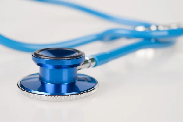 Blue stethoscope on white — Stock Photo, Image