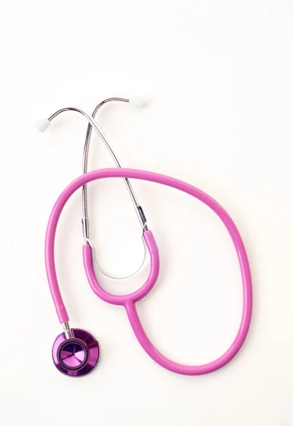 Roze stethoscoop op wit — Stockfoto