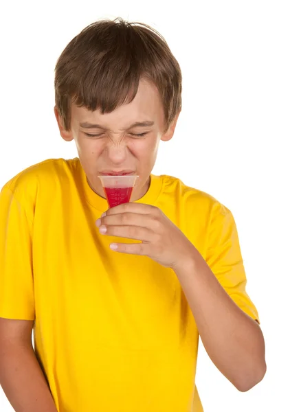 Boy drinking medicine — Stock Photo, Image