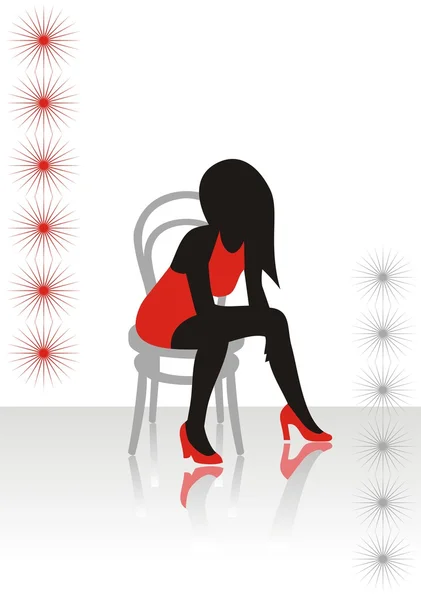The beautiful girl in a red dress sits on a chair — Stock Vector