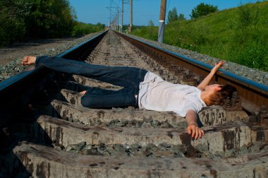 Girl laying on a railway clipart