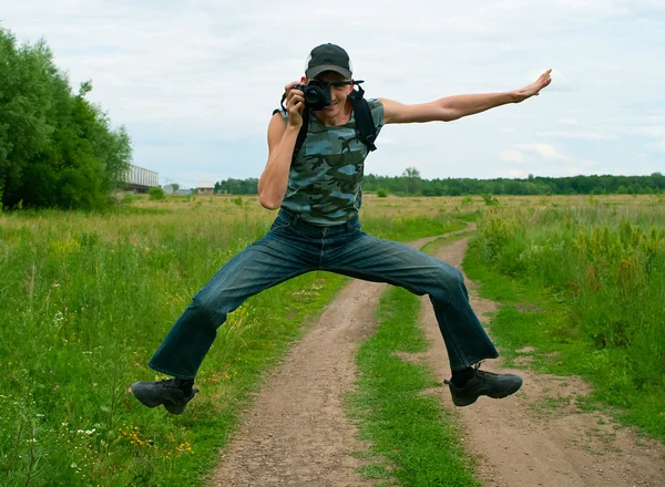 Men jumping and photographing — Stock Photo, Image