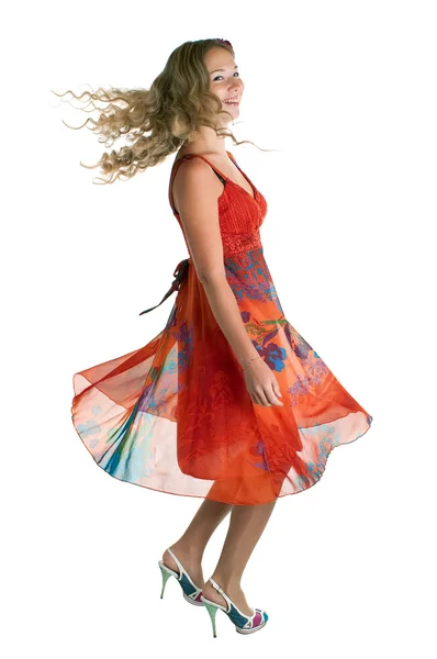 Dansende schoonheid meisje in oranje — Stockfoto