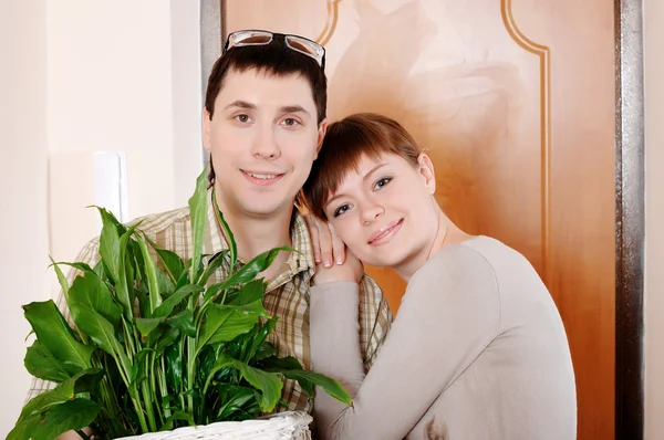 A charming young couple settlers went into their — Stock Photo, Image