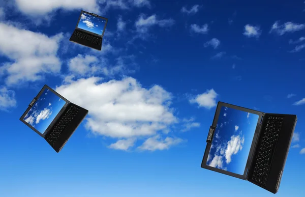 Flying flock of laptops — Stock Photo, Image
