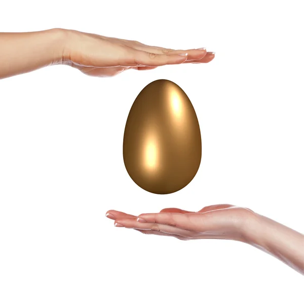 Χρυσό αυγό και τα χέρια — Φωτογραφία Αρχείου