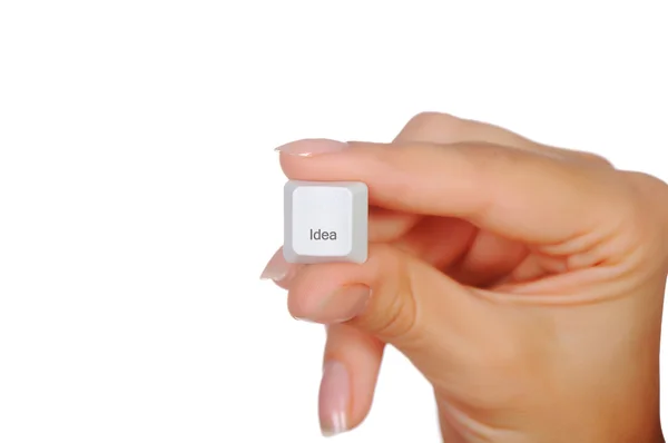 Mão e um botão branco — Fotografia de Stock