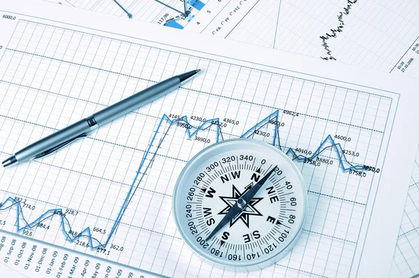 Graphs and charts with compass — Stock Photo, Image