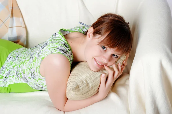 Young lovely brunette in green pajamas — Stock Photo, Image