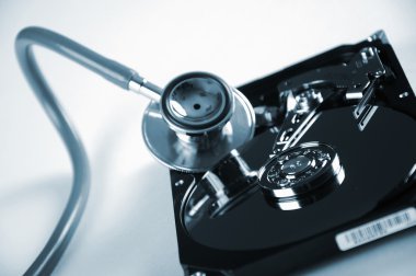 Computer hard drive and a stethoscope clipart