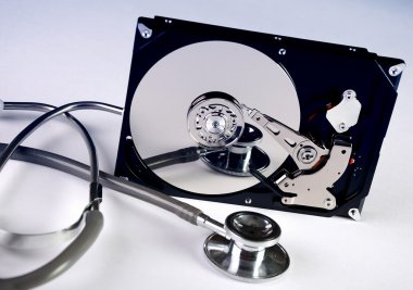 Computer hard drive and a stethoscope clipart